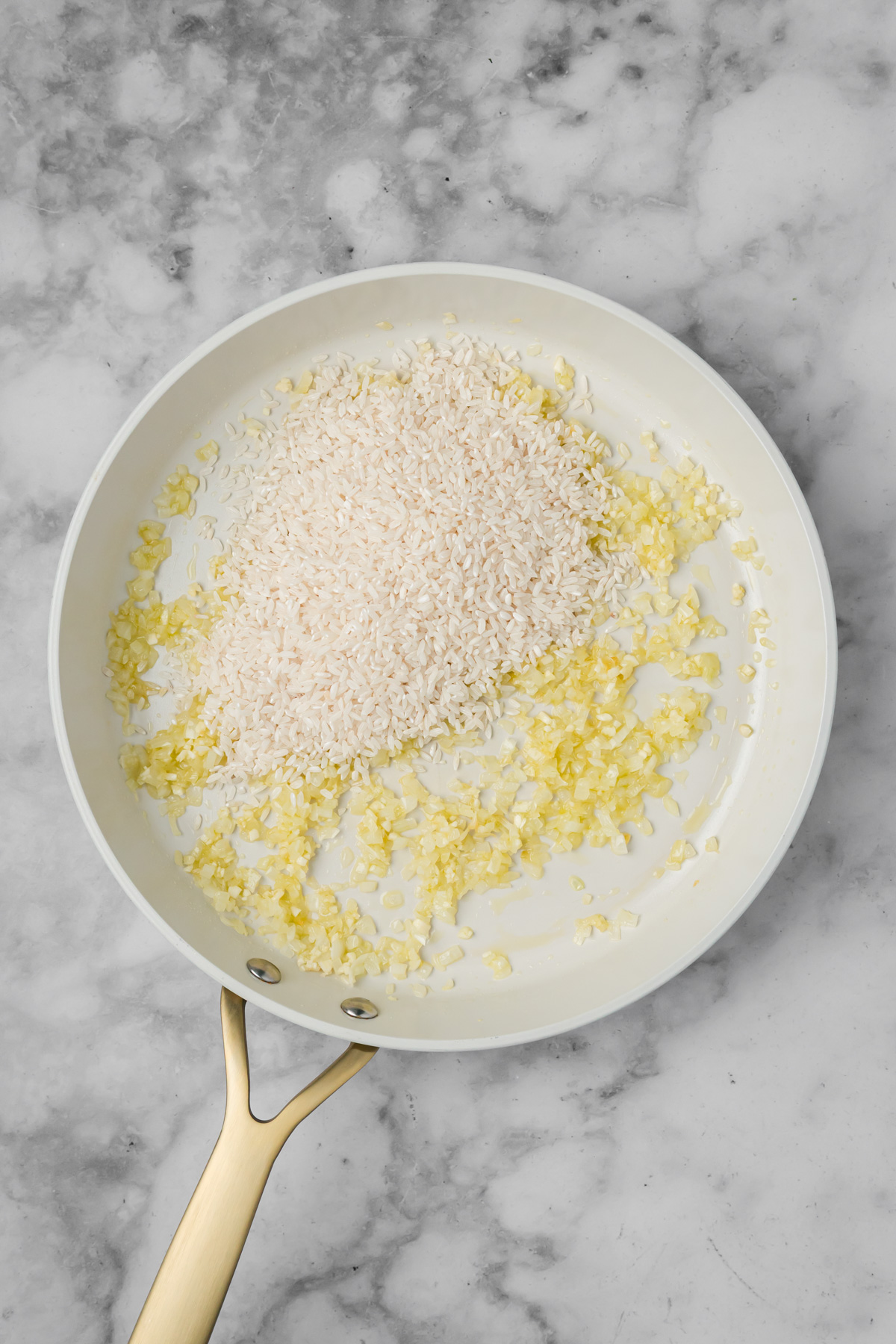 Rice added to the skillet.