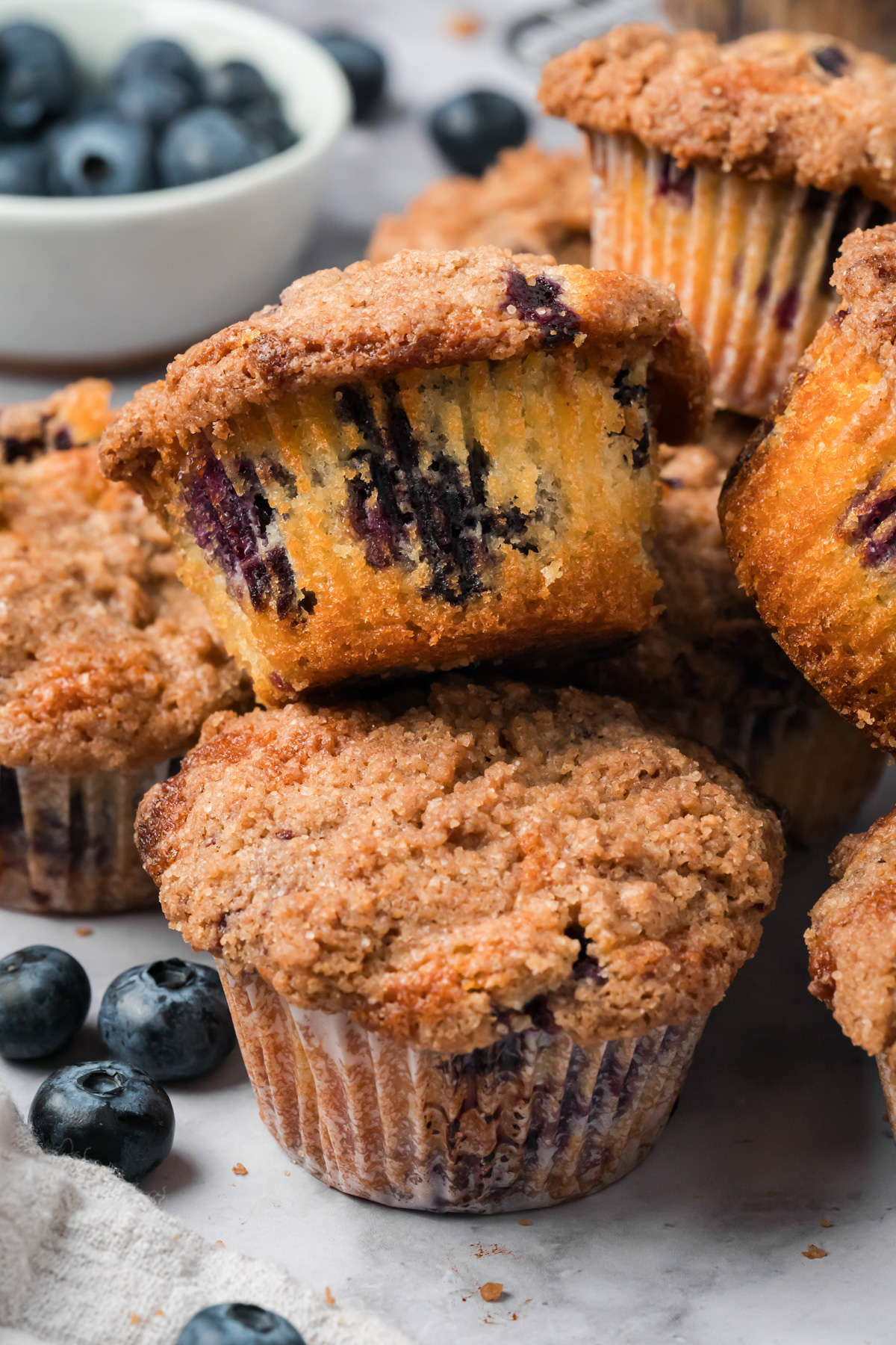 A pile of bakery style blueberry muffins.