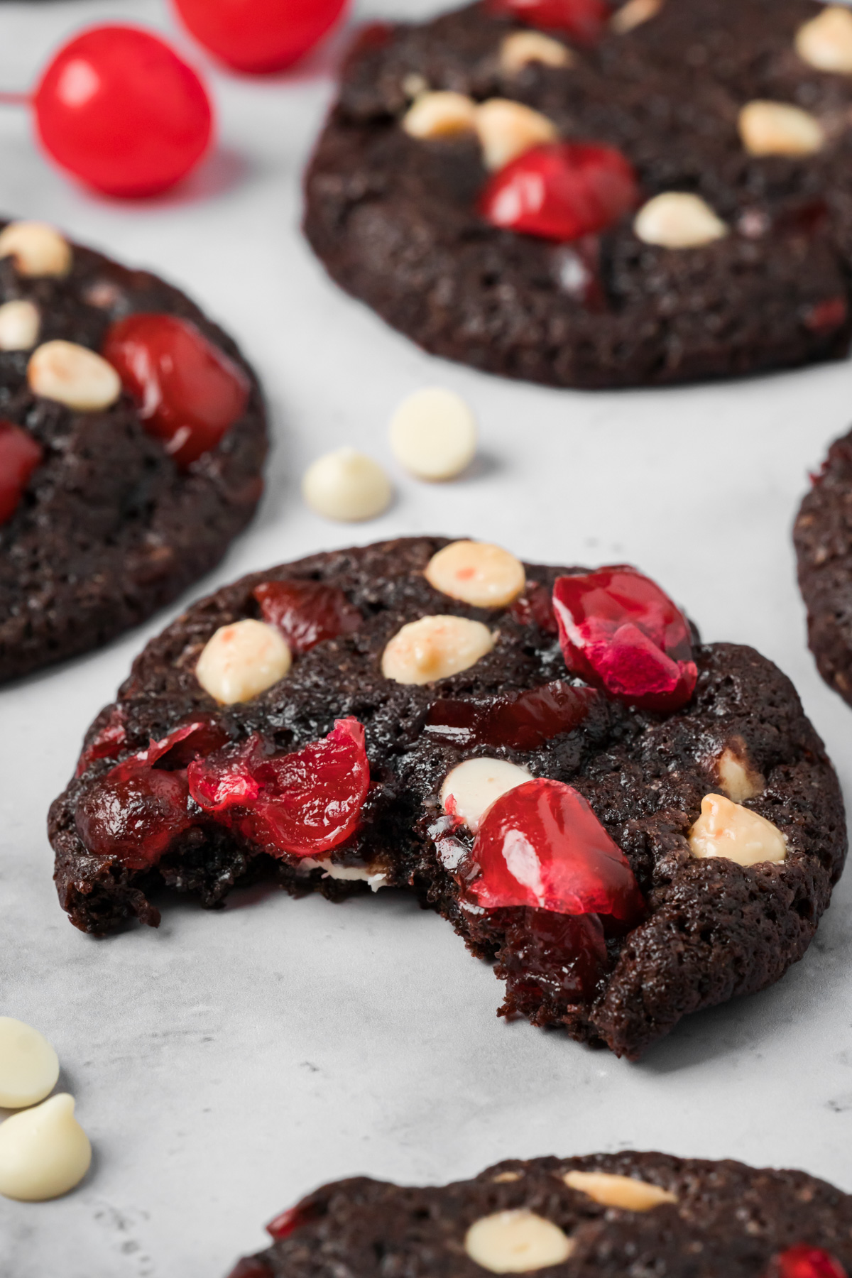 Black forest cookie with a bite taken out of it.