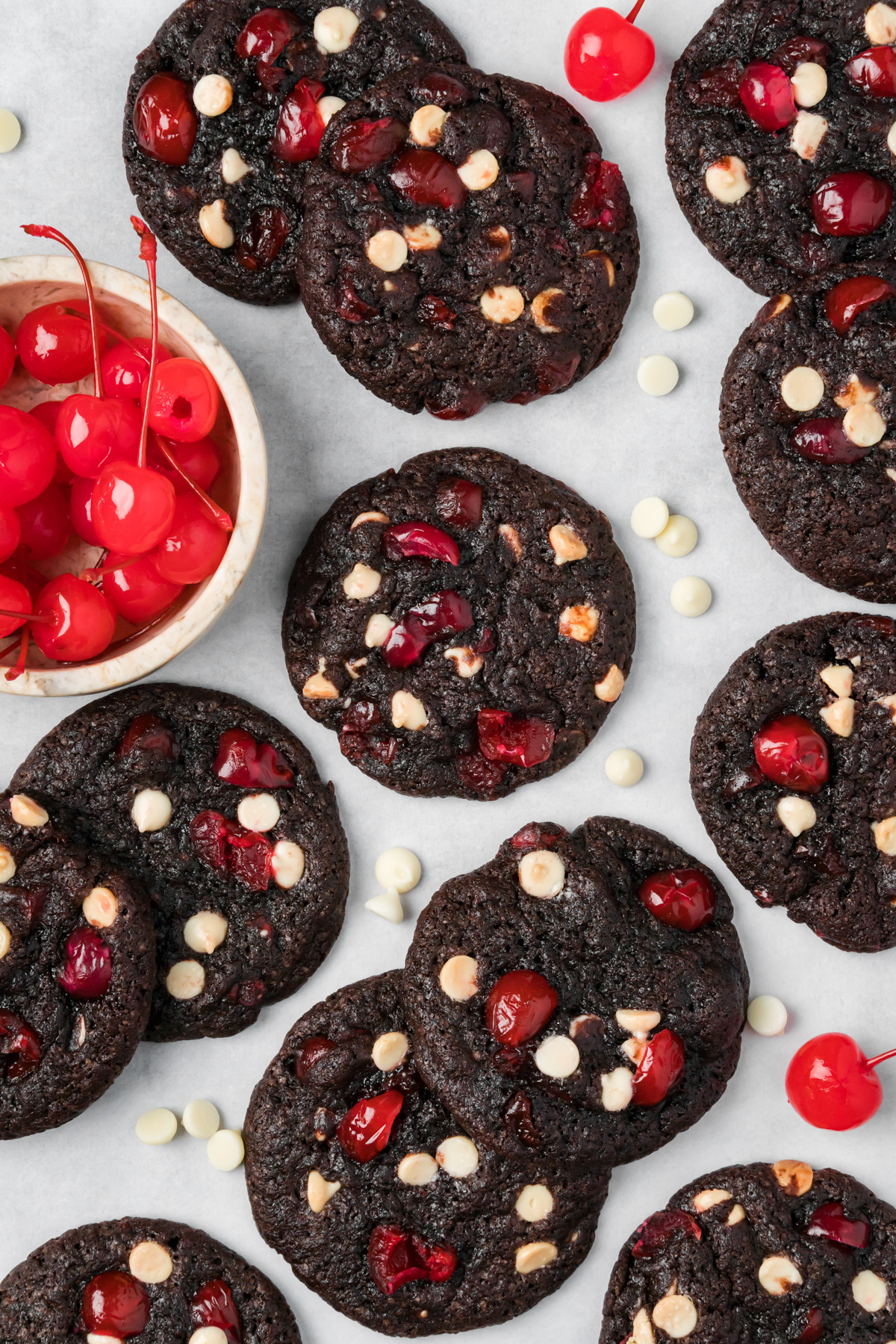 Black forest cookies with cherries and white chocolate chips around.