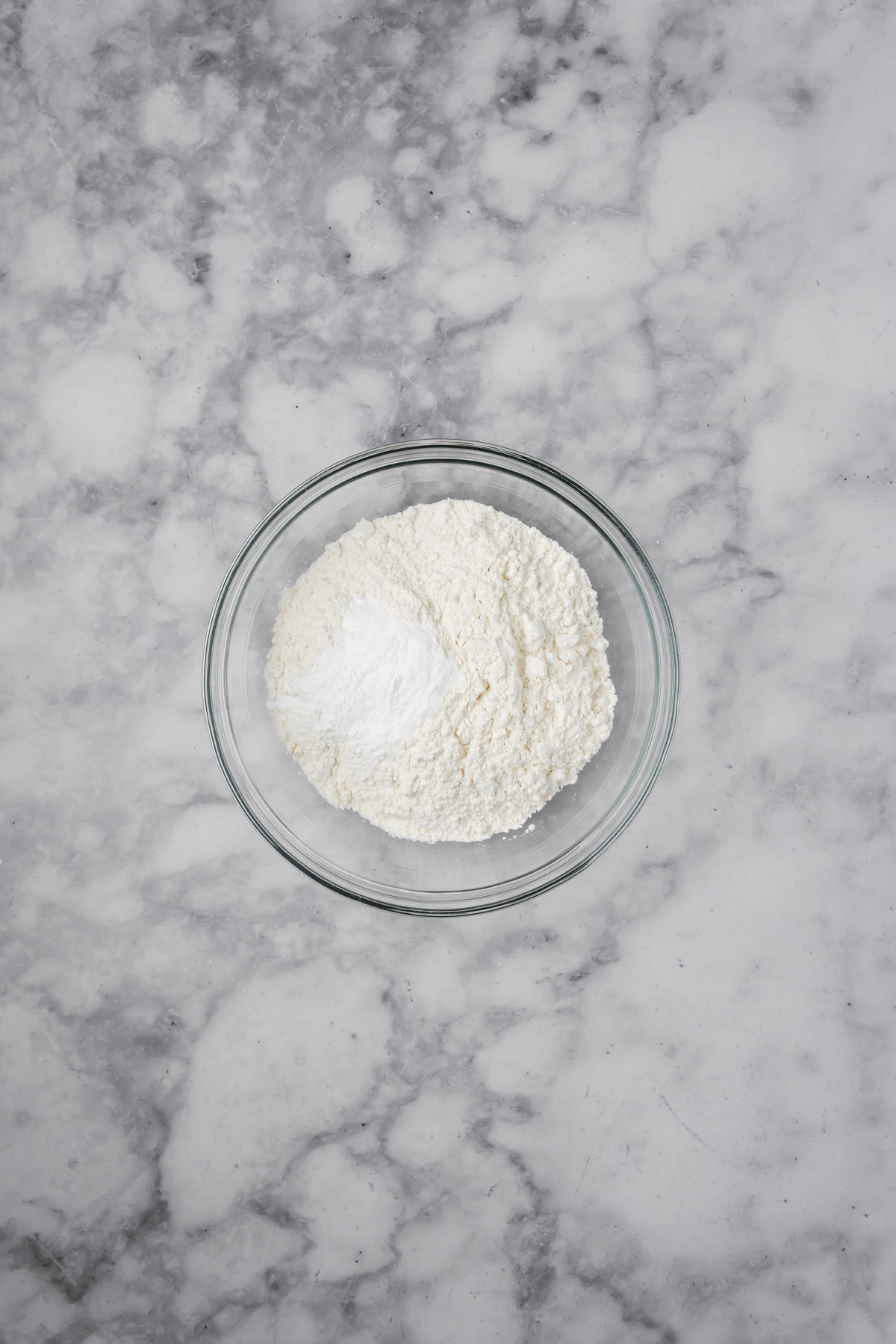 Dry ingredients in a glass bowl. 