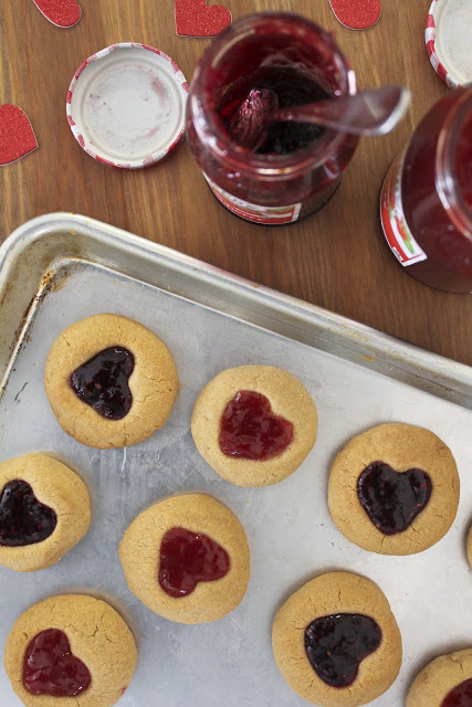 Peanut Butter and Jelly Thumbprint Cookies on a cookie sheet